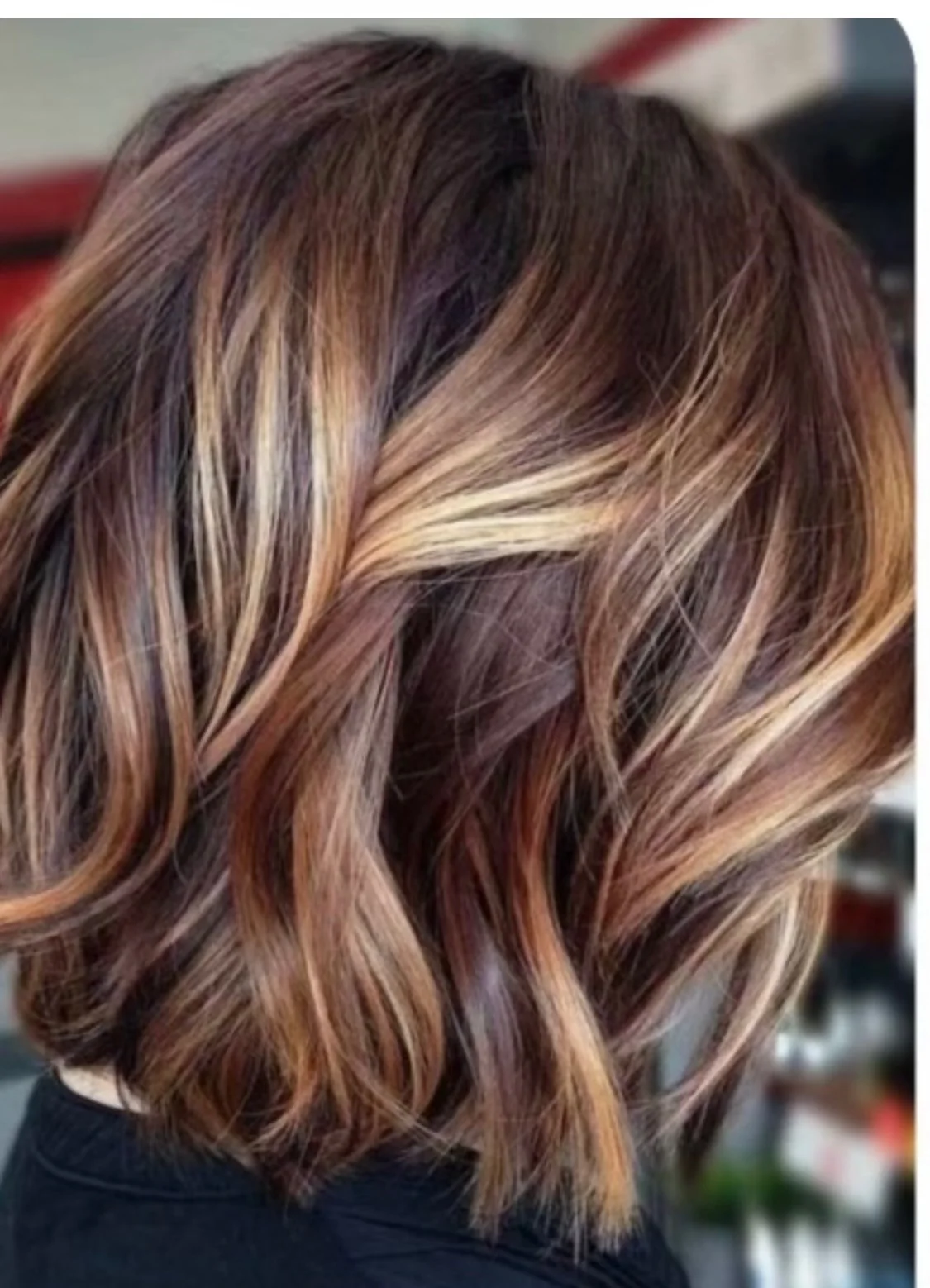 Softly layered brunette hair with dimensional highlights