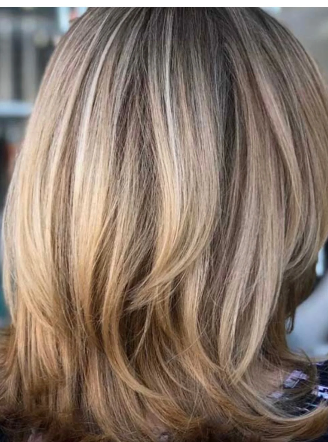 Layered blonde hair with natural-looking highlights